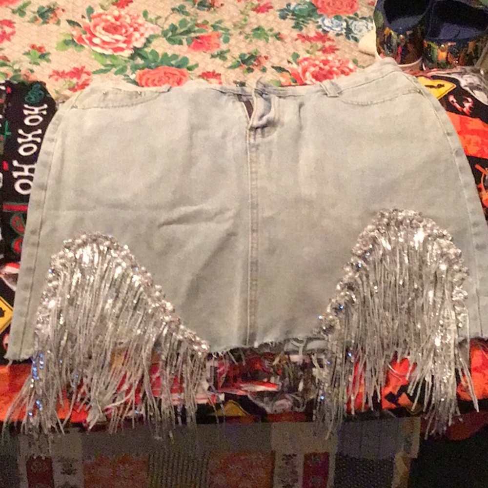 Denim mini skirt with blinged fringe. Brand new never worn.  Sized wrong